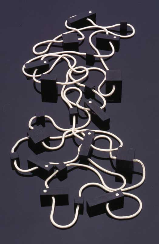 Submission by Chris Correia for the 1996 cube American Jewelry Design Council Project