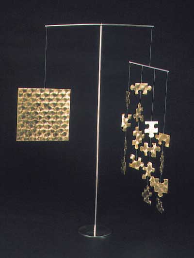 Submission by Eddie Sakamoto for the 1999 puzzle American Jewelry Design Council Project