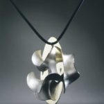 Submission by Michael Good for the 1998 key American Jewelry Design Council Project