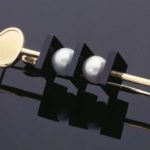 Submission by Susan Sadler for the 1996 cube American Jewelry Design Council Project