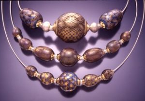 Blue Tan Eggs Spheres On Silver Cable